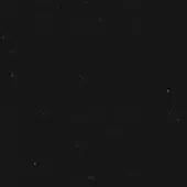 Monochromatic granular texture with irregular light gray speckling on a dark gray background, creating a muted, uniform surface pattern.